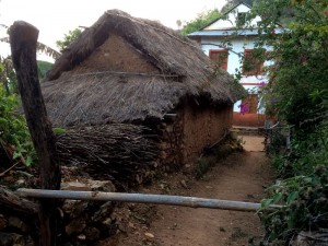 Mud huts and more modern builds sit side by side.