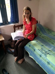 Nora, relaxing in our room after a tough taxi ride. Nora, relaxing in our room after a tough taxi ride.