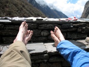 Drying sock and tanning feet.