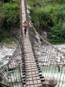 Kids racing across a bridge.